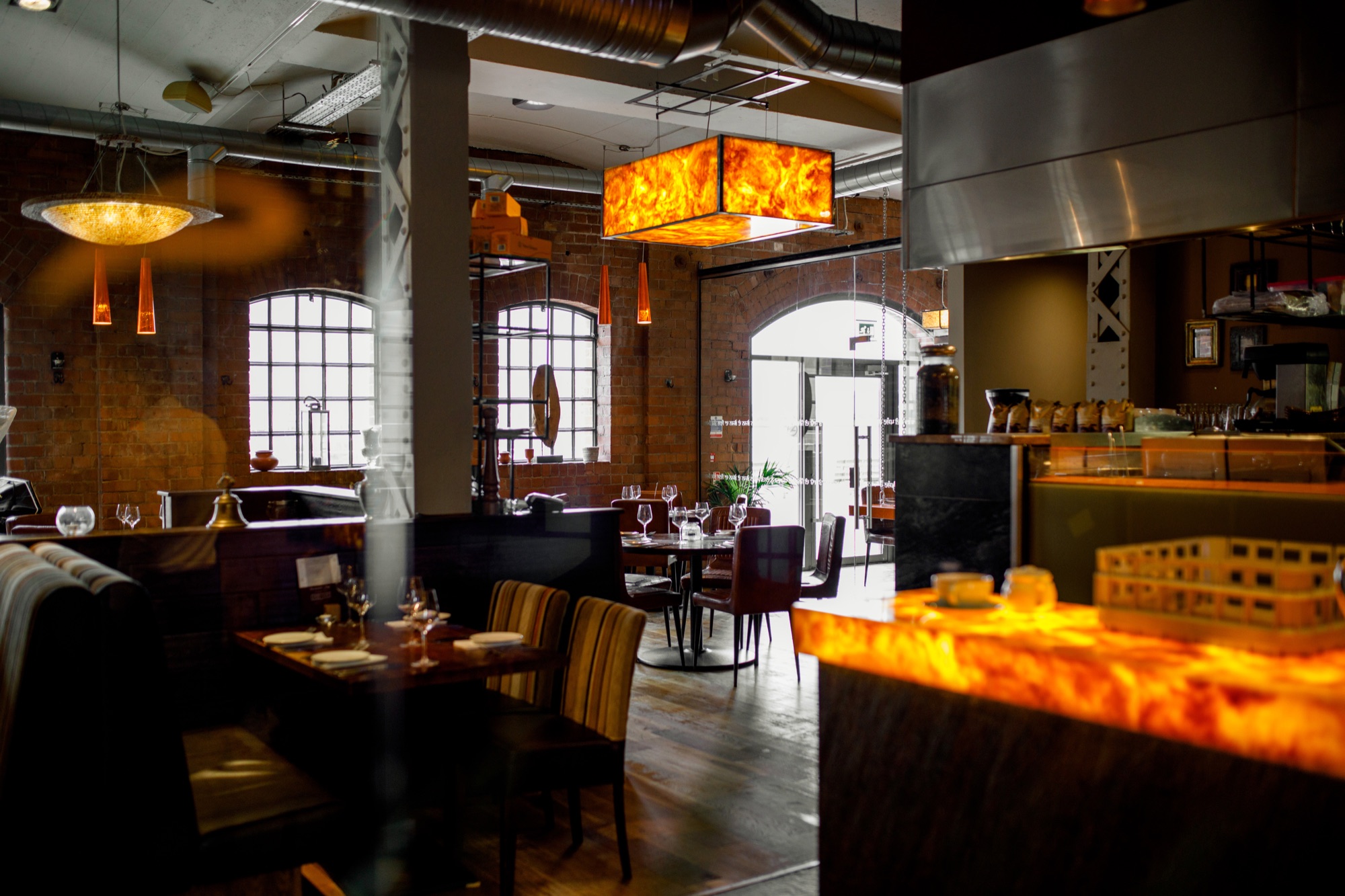 Open dining area with brick walls and salt-light fixture